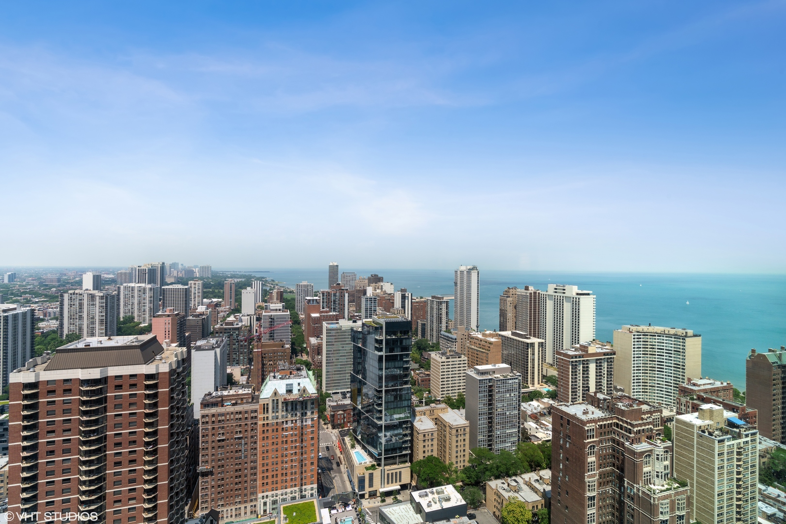1030 North State Street, Unit 39B Chicago, IL 60610 - Photo 19 of 23 a view of a city with tall buildings