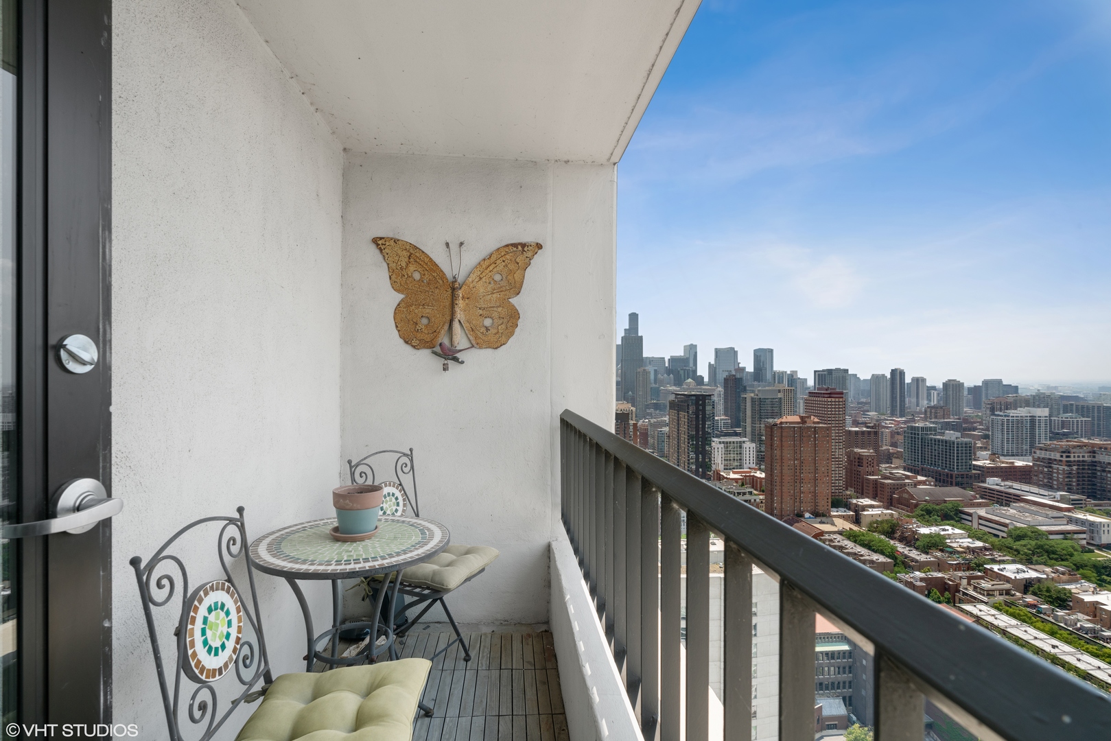 1030 North State Street, Unit 39B Chicago, IL 60610 - Photo 20 of 23 a view of a balcony with chairs