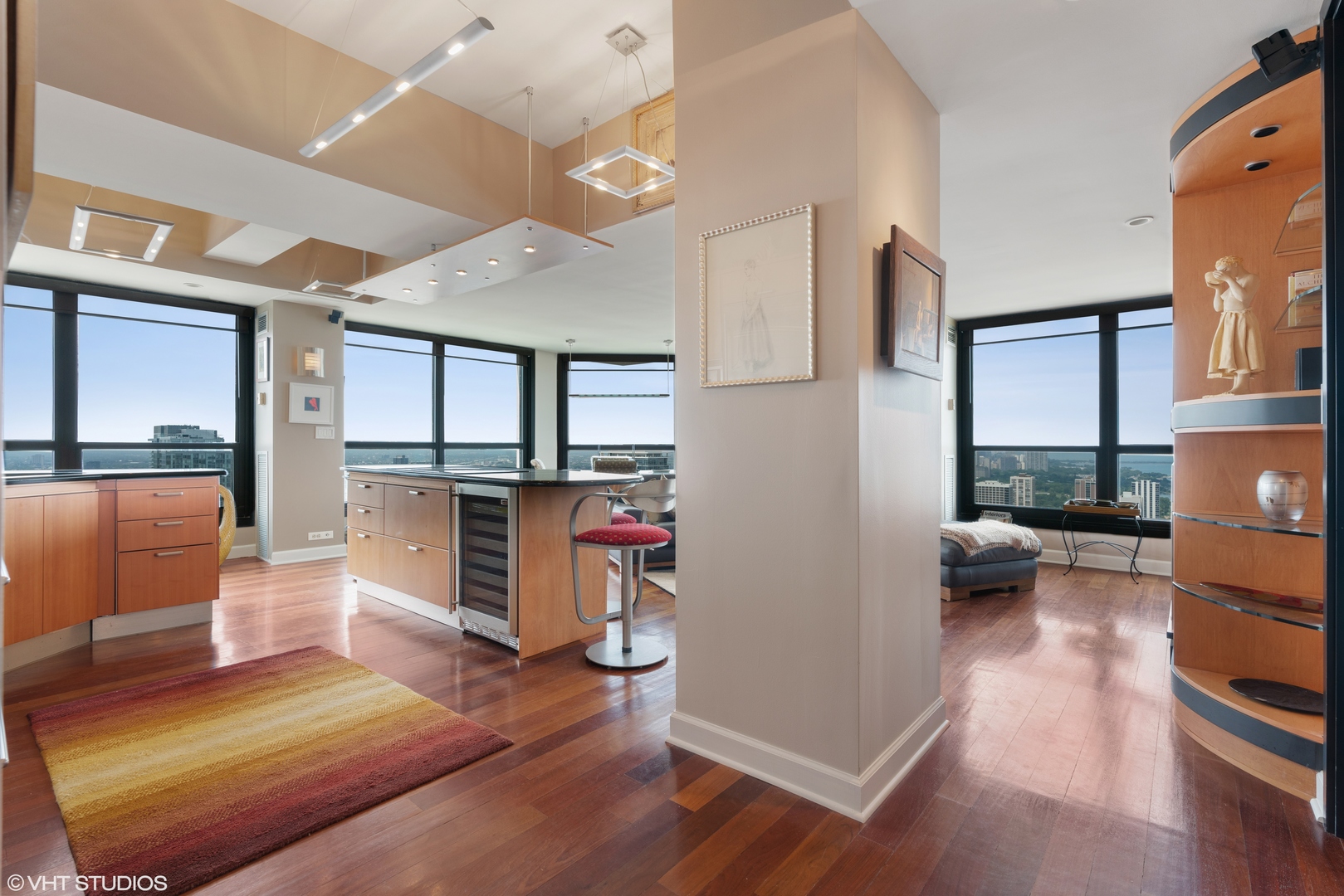 1030 North State Street, Unit 39B Chicago, IL 60610 - Photo 3 of 23 a living room with furniture and a wooden floor
