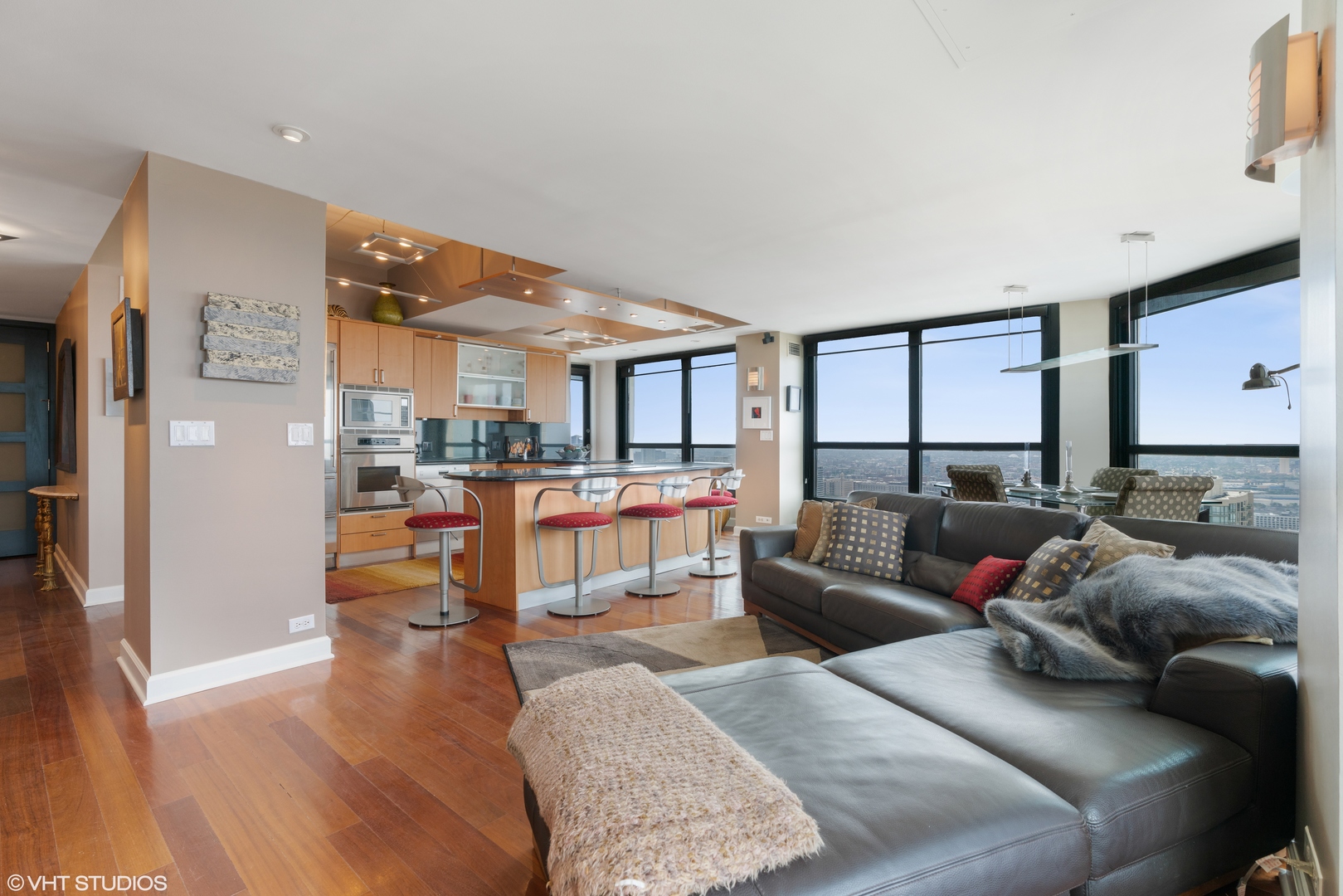 1030 North State Street, Unit 39B Chicago, IL 60610 - Photo 5 of 23 a living room with furniture and a wooden floor