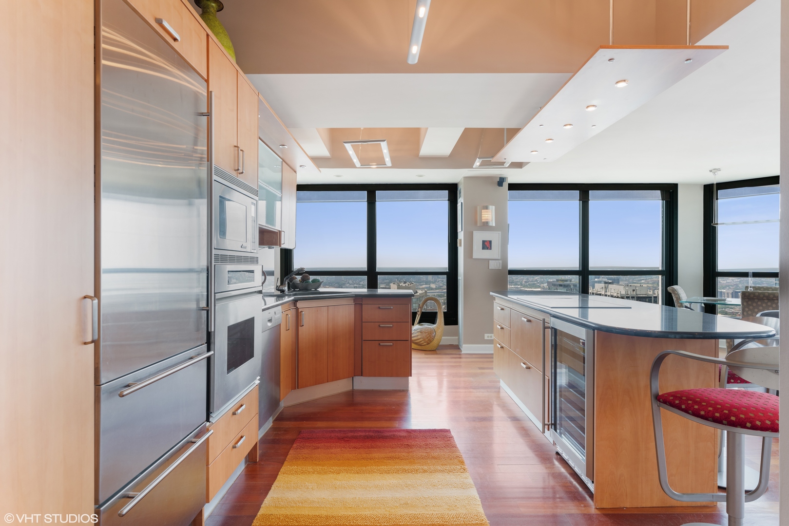 1030 North State Street, Unit 39B Chicago, IL 60610 - Photo 8 of 23 a kitchen with stainless steel appliances granite countertop a refrigerator and a stove