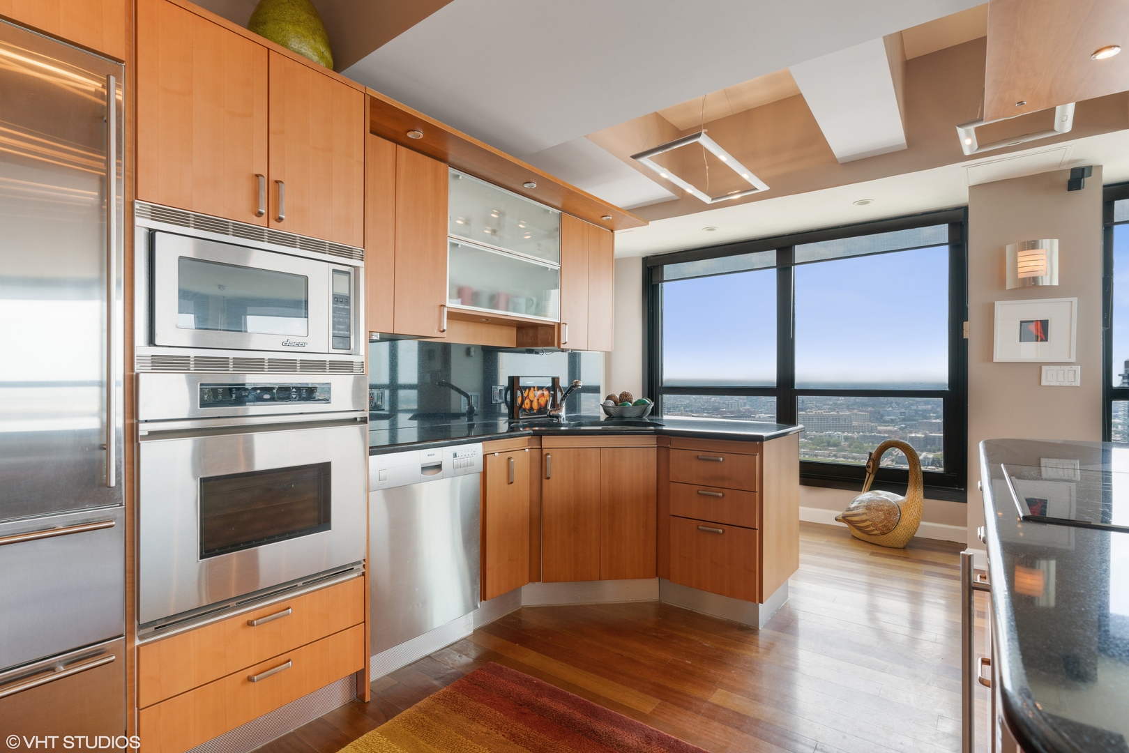 1030 North State Street, Unit 39B Chicago, IL 60610 - Photo 9 of 23 a kitchen with stainless steel appliances a refrigerator and stove