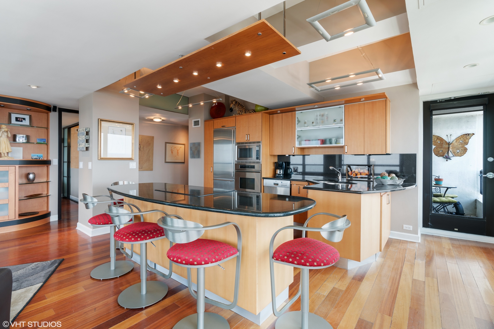 1030 North State Street, Unit 39B Chicago, IL 60610 - Photo 10 of 23 a dining room with furniture and wooden floor