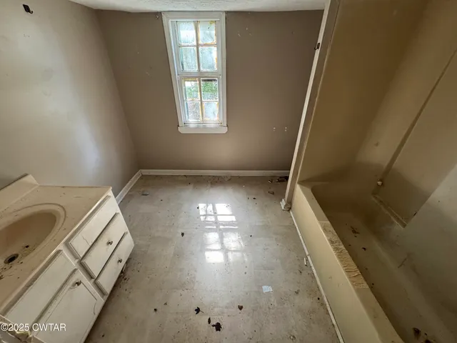 a bathroom with a shower and a toilet