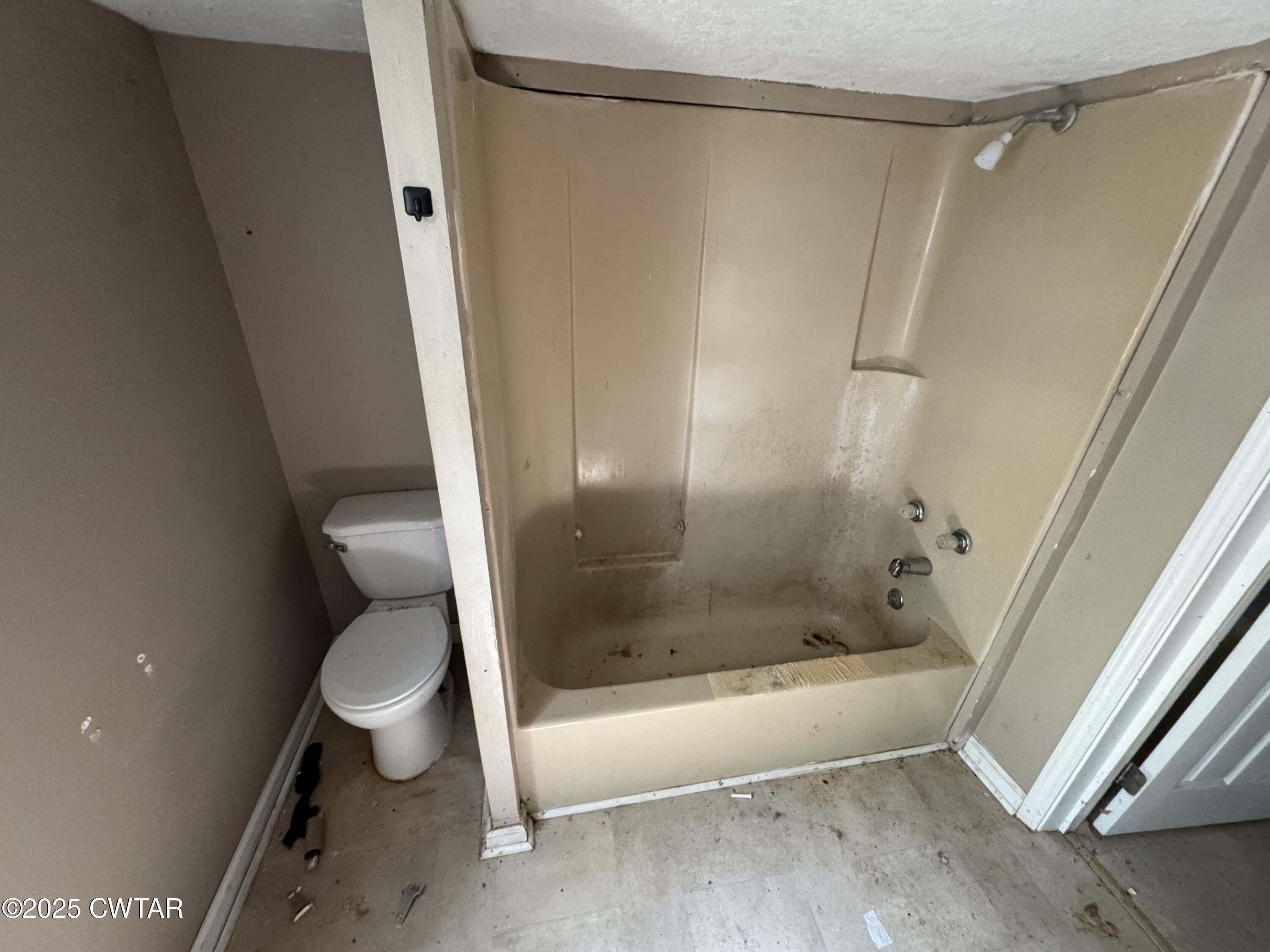 188 Mill Street Trimble, TN 38259 - Photo 15 of 17 a bathroom with a shower and a toilet