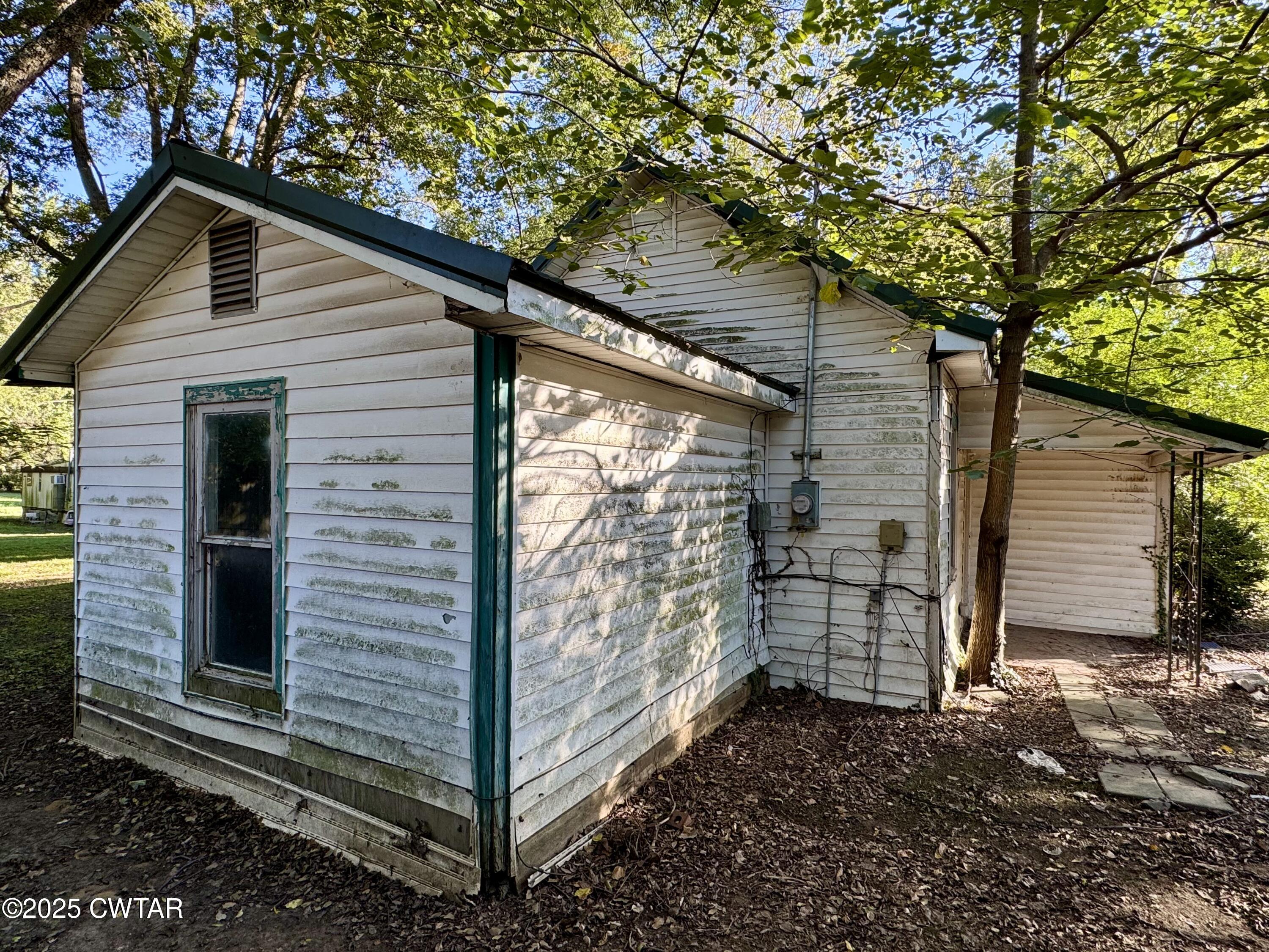 188 Mill Street Trimble, TN 38259 - Photo 2 of 17 a view of a small house with large tree