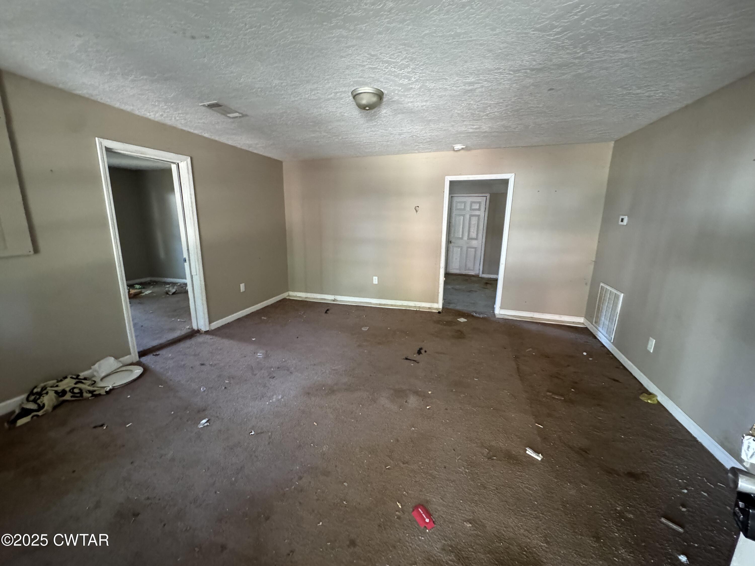 188 Mill Street Trimble, TN 38259 - Photo 8 of 17 wooden floor and window in an empty room