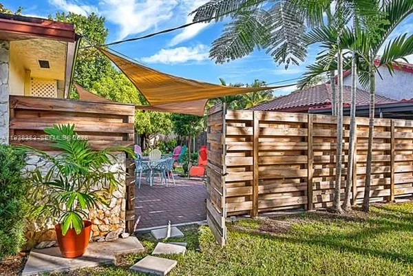 a backyard of a house with seating space