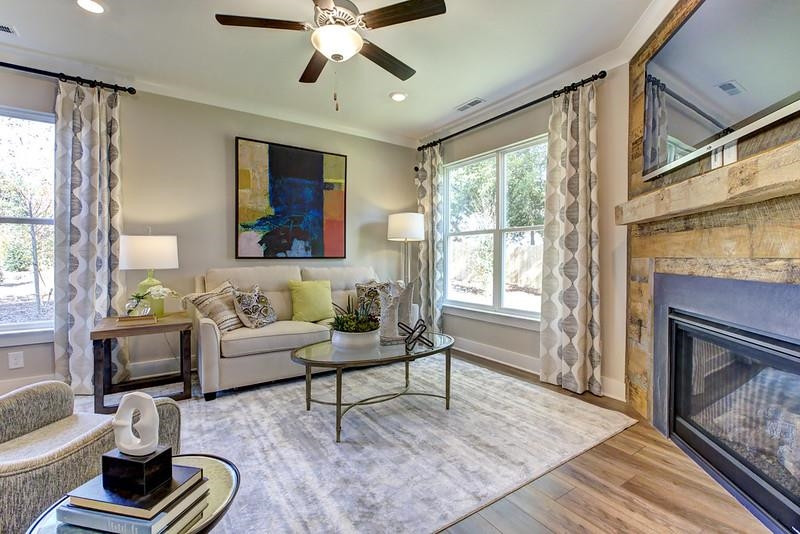 1000 Heartstone Way Durham, NC 27713 - Photo 21 of 35 a living room with furniture a fireplace and a large window