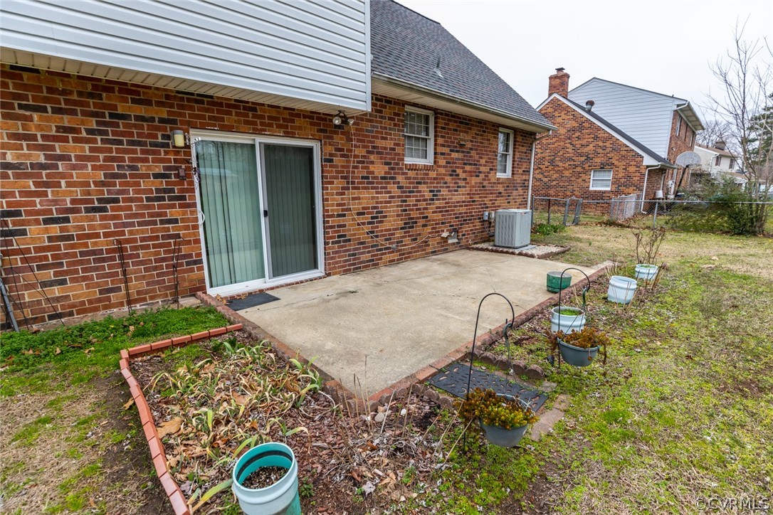 4636 Treely Road Chester, VA 23831 - Photo 11 of 48 a backyard of a house with yard and outdoor seating