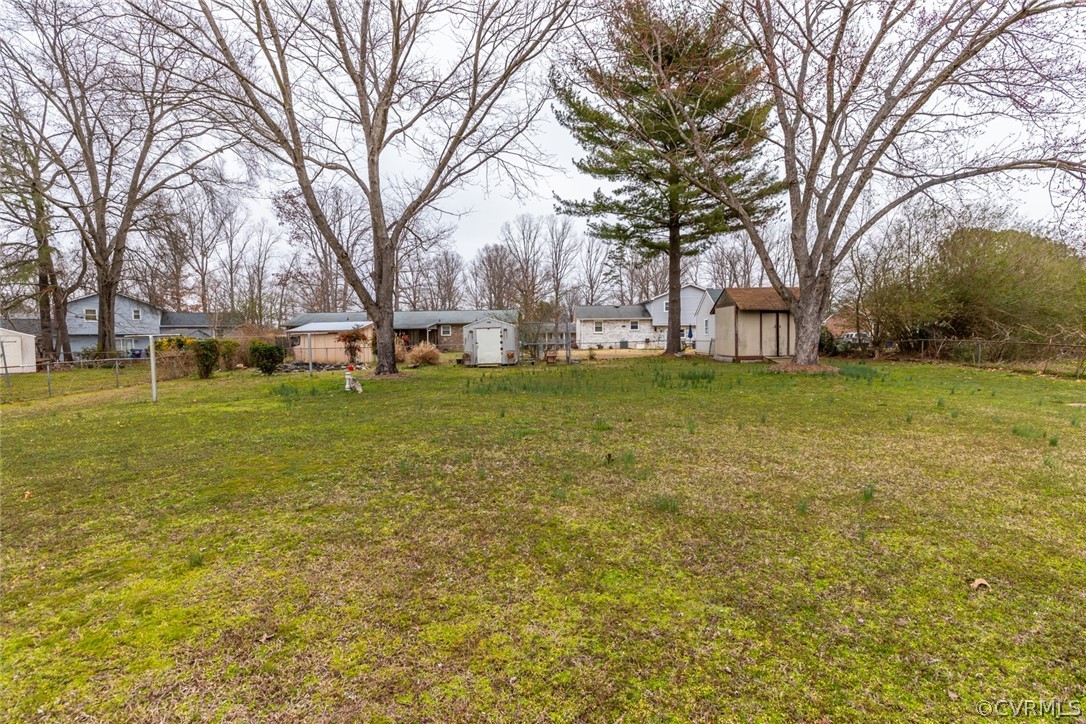 4636 Treely Road Chester, VA 23831 - Photo 12 of 48 a view of a field with large trees