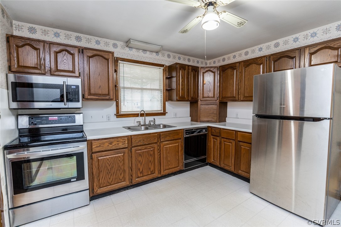 4636 Treely Road Chester, VA 23831 - Photo 19 of 48 a kitchen with granite countertop stainless steel appliances and wooden cabinets