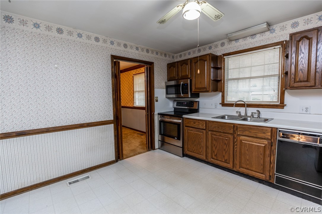 4636 Treely Road Chester, VA 23831 - Photo 22 of 48 a kitchen with granite countertop cabinets stainless steel appliances a sink and a window