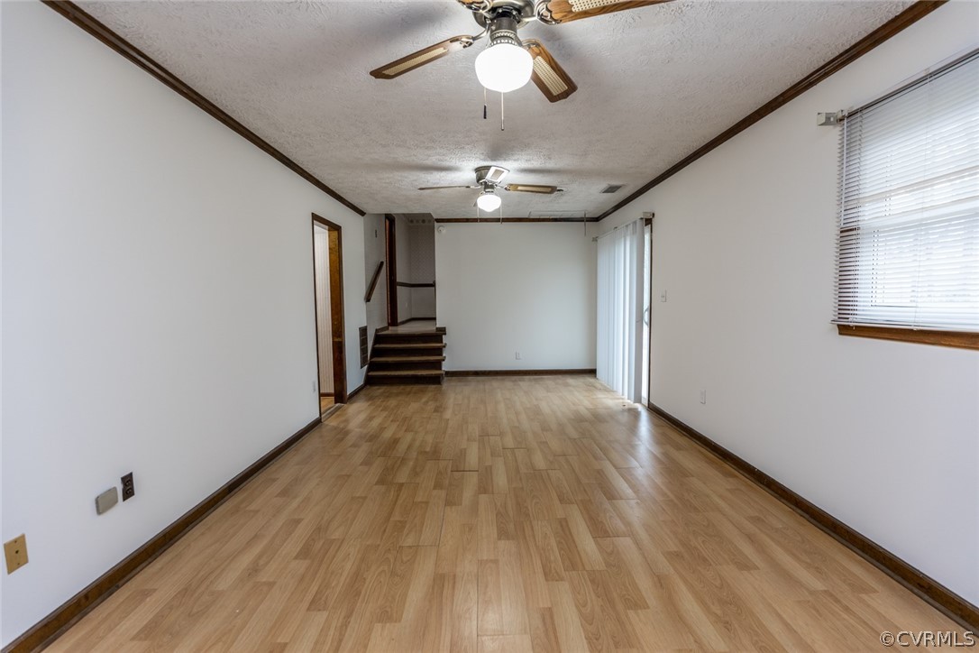 4636 Treely Road Chester, VA 23831 - Photo 26 of 48 a view of empty room with wooden floor and fan