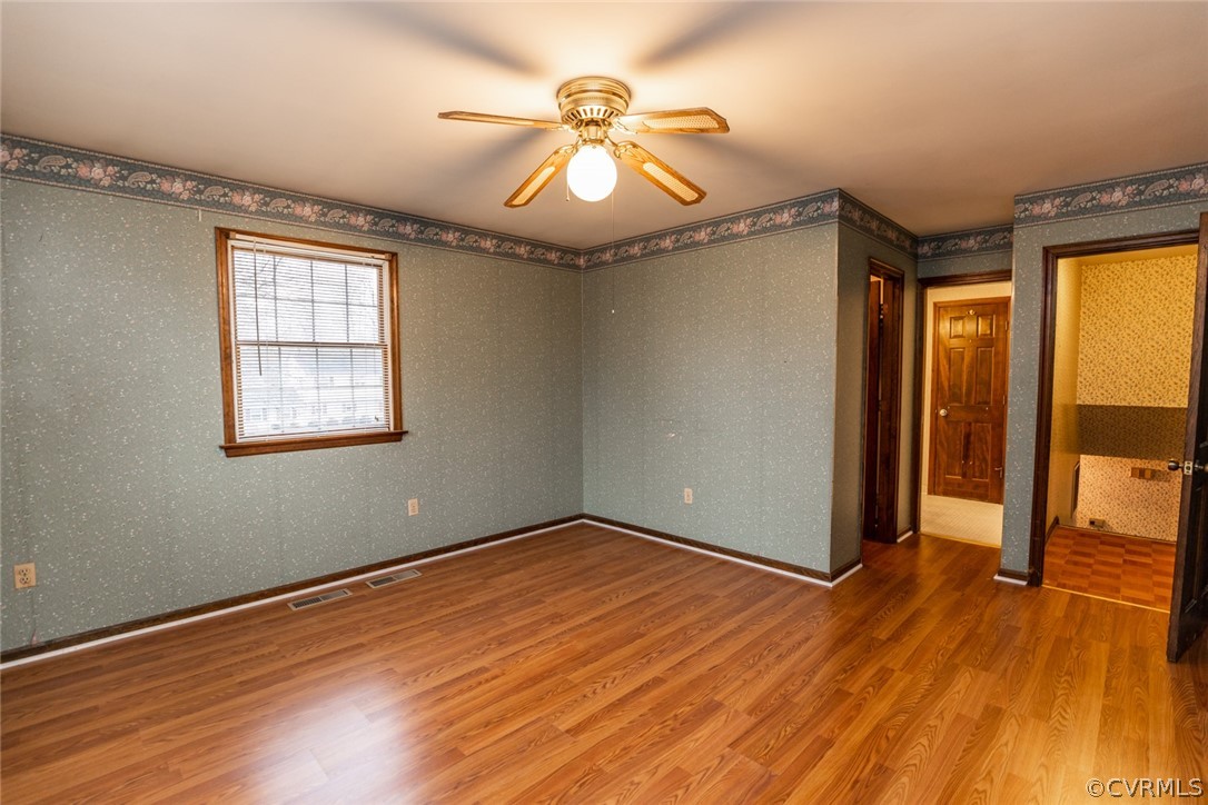 4636 Treely Road Chester, VA 23831 - Photo 34 of 48 wooden floor in an empty room with a window