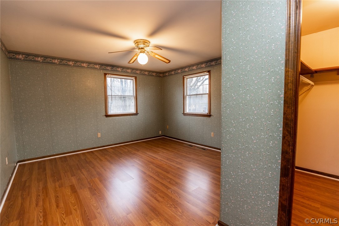 4636 Treely Road Chester, VA 23831 - Photo 35 of 48 a view of an empty room with wooden floor and a window