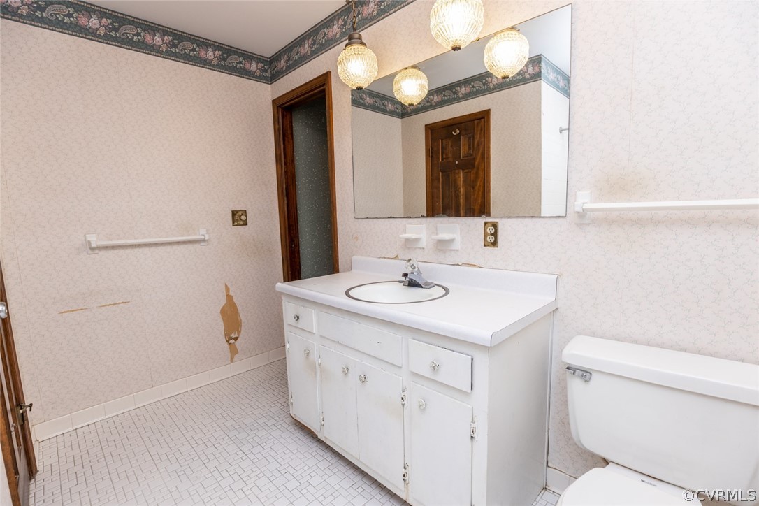 4636 Treely Road Chester, VA 23831 - Photo 40 of 48 a bathroom with a sink a toilet and a mirror