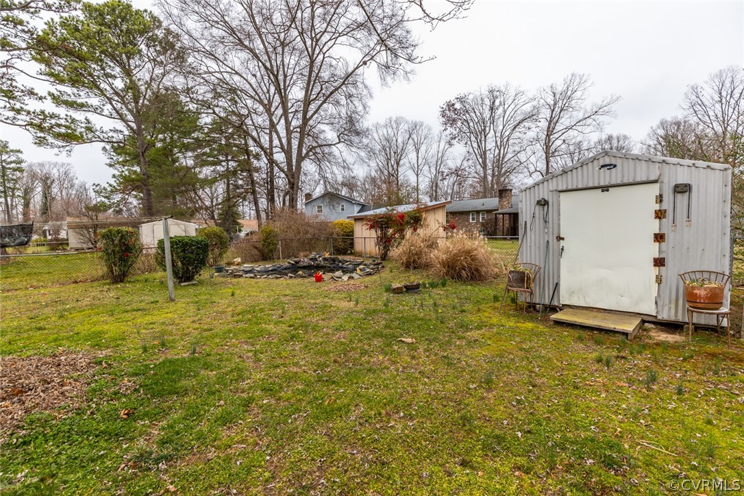 4636 Treely Road Chester, VA 23831 - Photo 8 of 48 a view of a white house with a yard