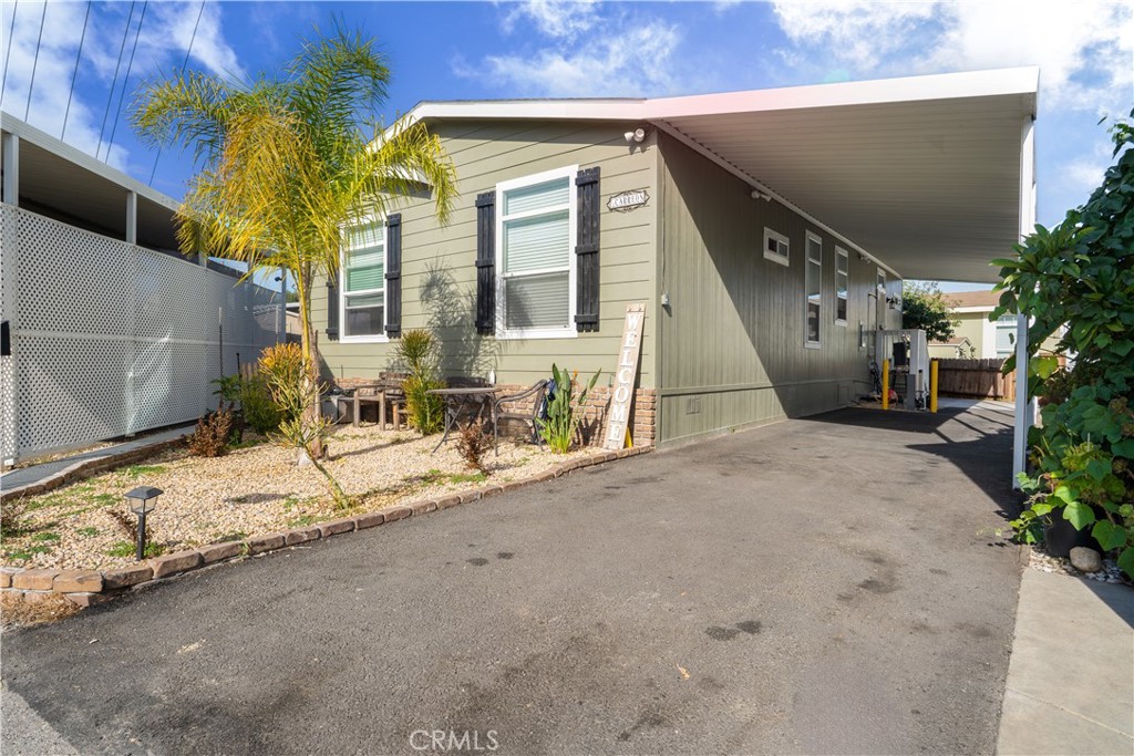 7101 Rosecrans Avenue, Unit 137 Paramount, CA 90723 - Photo 19 of 30 a view of a house with a patio