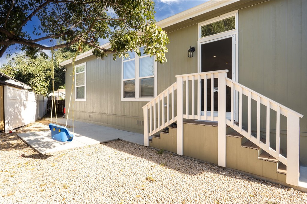7101 Rosecrans Avenue, Unit 137 Paramount, CA 90723 - Photo 21 of 30 a view of a house with backyard and sitting area