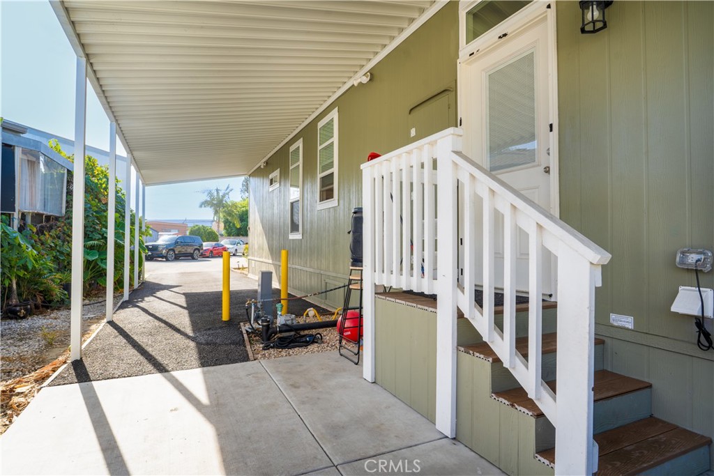 7101 Rosecrans Avenue, Unit 137 Paramount, CA 90723 - Photo 22 of 30 a view of staircase with lots of stuff and hardwood
