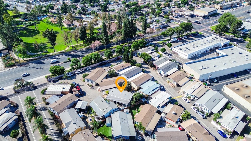 7101 Rosecrans Avenue, Unit 137 Paramount, CA 90723 - Photo 25 of 30 an aerial view of residential house with outdoor space and parking