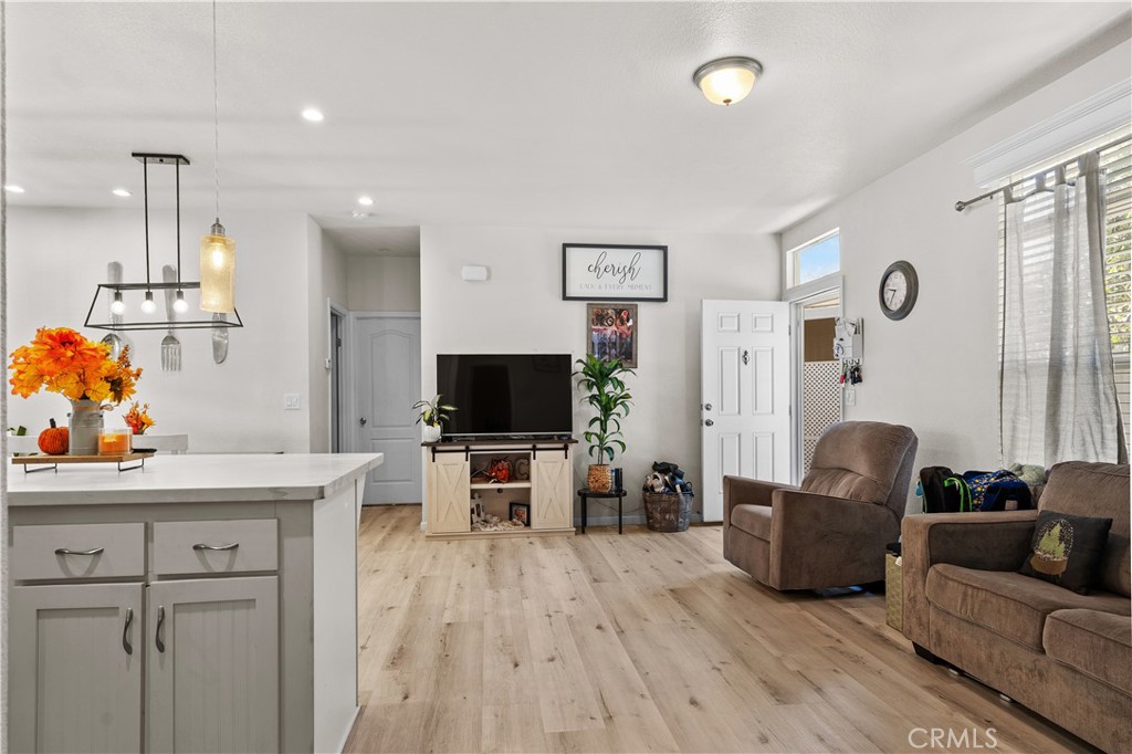7101 Rosecrans Avenue, Unit 137 Paramount, CA 90723 - Photo 3 of 30 a living room with furniture and a flat screen tv