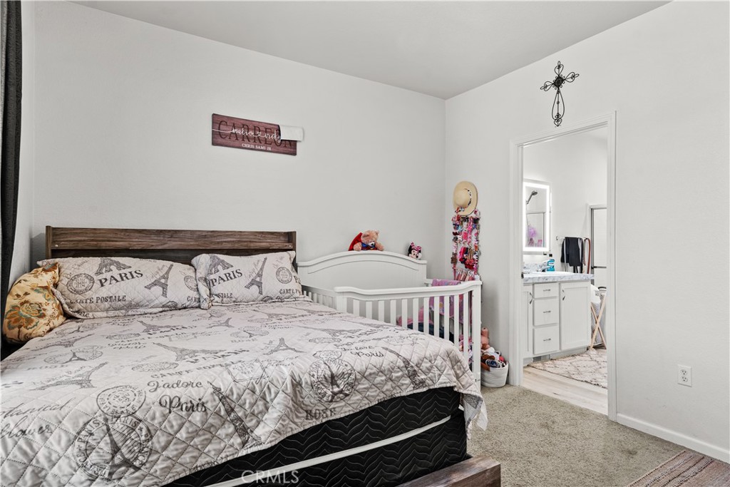 7101 Rosecrans Avenue, Unit 137 Paramount, CA 90723 - Photo 10 of 30 a bedroom with a bed and a table