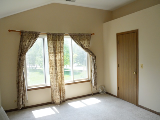 1303 Providence Circle, Unit 1303 Elgin, IL 60120 - Photo 11 of 16 a view of an empty room with a window