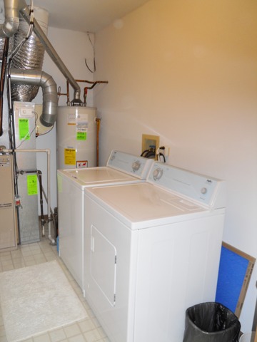 1303 Providence Circle, Unit 1303 Elgin, IL 60120 - Photo 14 of 16 a utility room with dryer and washer