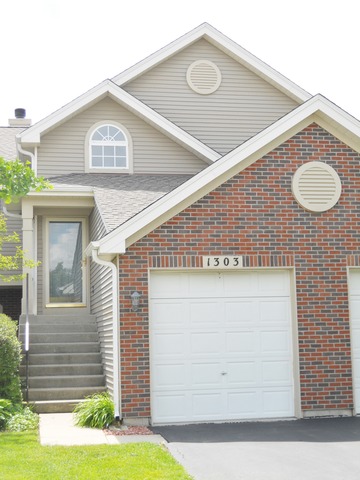 1303 Providence Circle, Unit 1303 Elgin, IL 60120 - Photo 2 of 16 a view of a house with a swimming pool