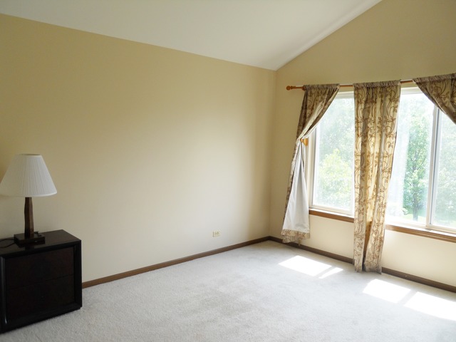 1303 Providence Circle, Unit 1303 Elgin, IL 60120 - Photo 10 of 16 a view of an empty room with a window