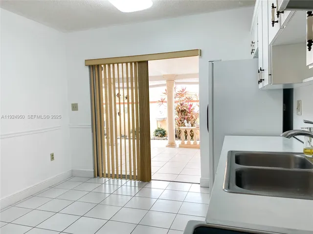 a spacious bathroom with a bathtub and next to a window