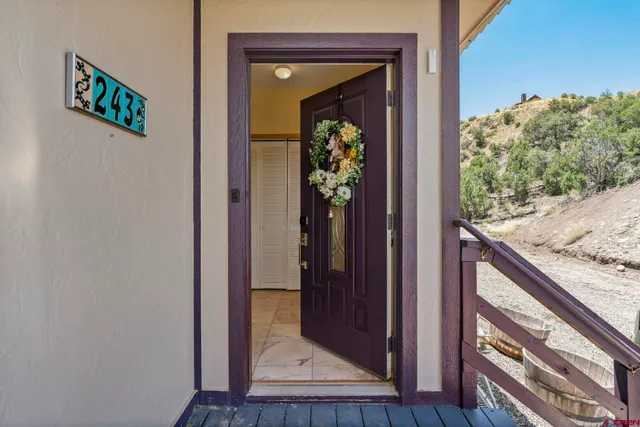 a view of a hallway with wooden floor and a wooden floor