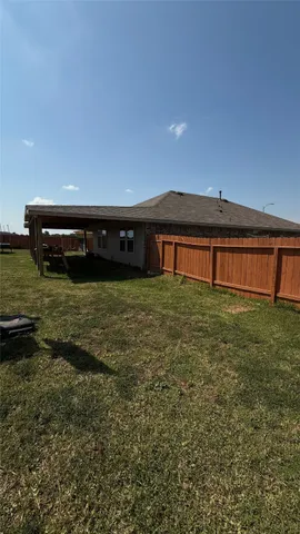 a view of a house with a big yard