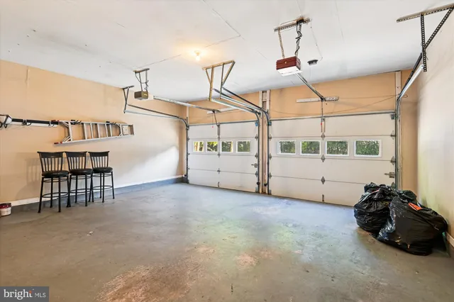 a view of a livingroom with furniture and white walls