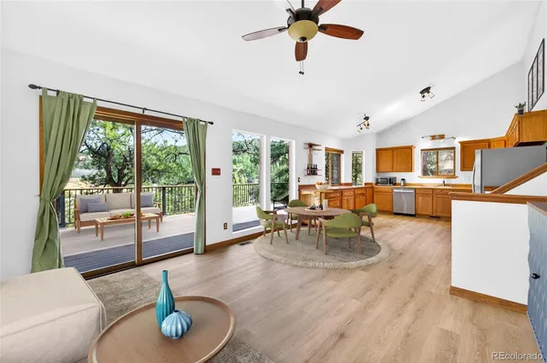 a living room with furniture and a floor to ceiling window