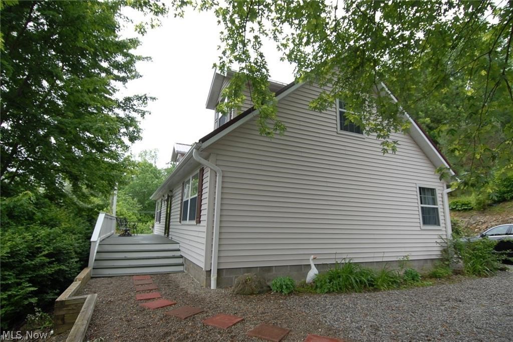 7170 Old Town Road Mount Perry, OH 43760 - Photo 3 of 41 View of property exterior featuring a wooden deck