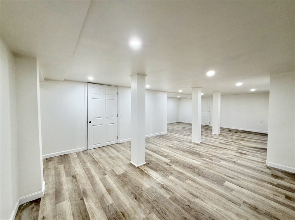 9 Robbins Street Waltham, MA 02453 - Photo 29 of 42 a view of empty room with wooden floor
