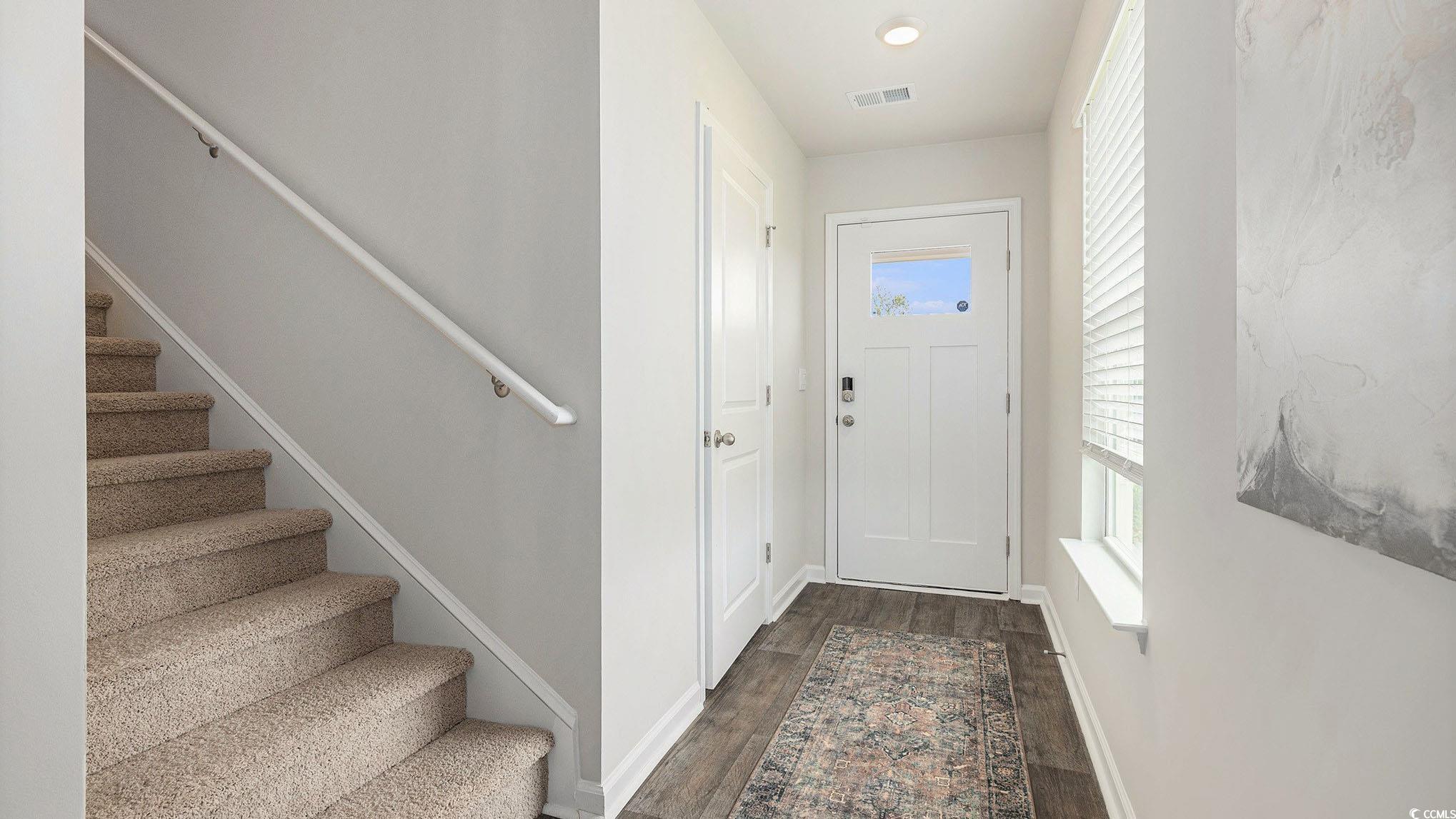 3579 Ashridge Way Conway, SC 29526 - Photo 2 of 27 Entryway featuring stairs, dark wood-style flooring, and baseboards