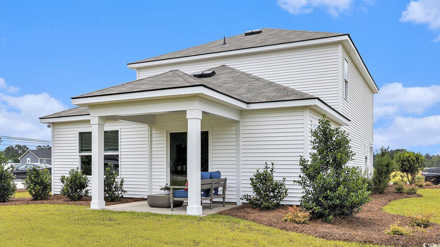 3579 Ashridge Way Conway, SC 29526 - Photo 26 of 27 Back of property featuring a patio area, a yard, and roof with shingles