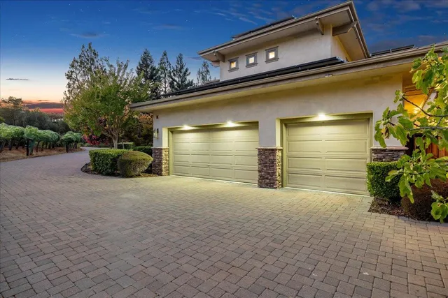 a view of a patio with a table chairs and a backyard