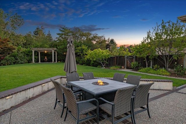 a kitchen with stainless steel appliances granite countertop a stove and a refrigerator
