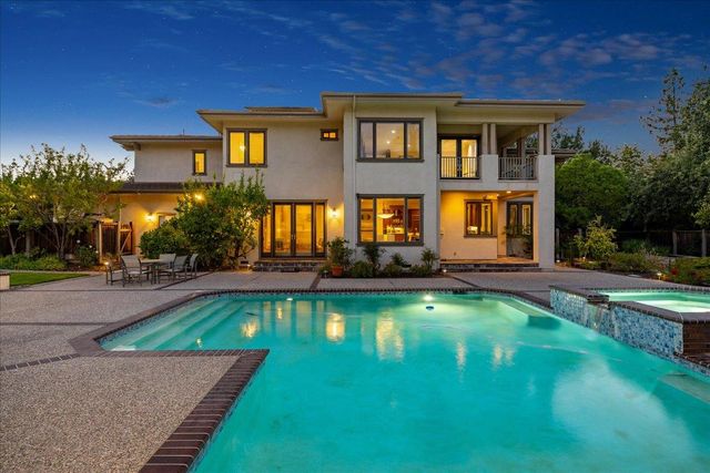 a front view of a house with swimming pool