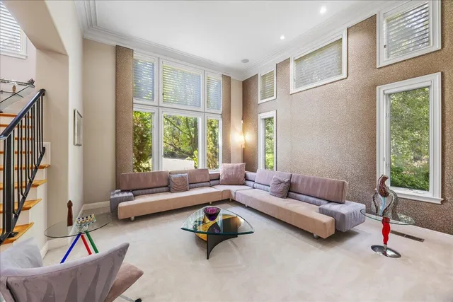 a spacious bedroom with a bed and a large window