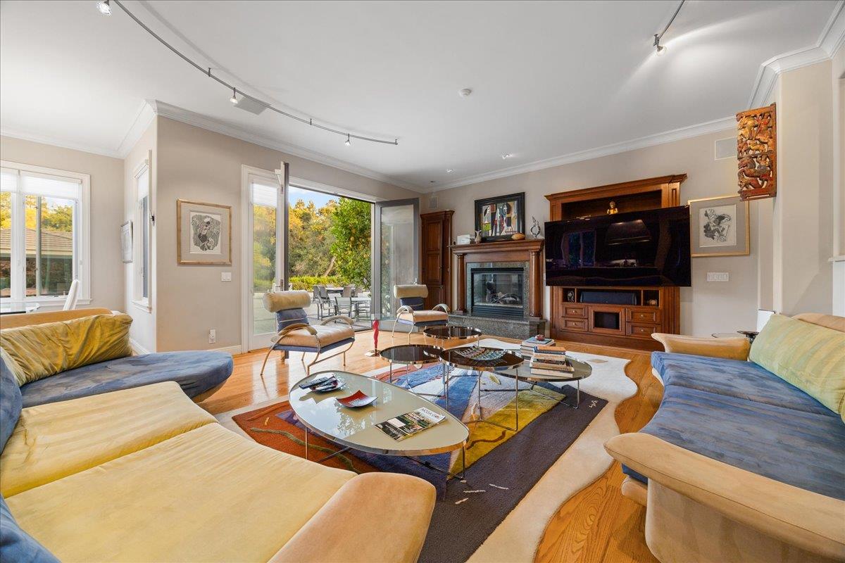 20040 Spaich Court Saratoga, CA 95070 - Photo 28 of 87 a living room with furniture flat screen tv and a large window