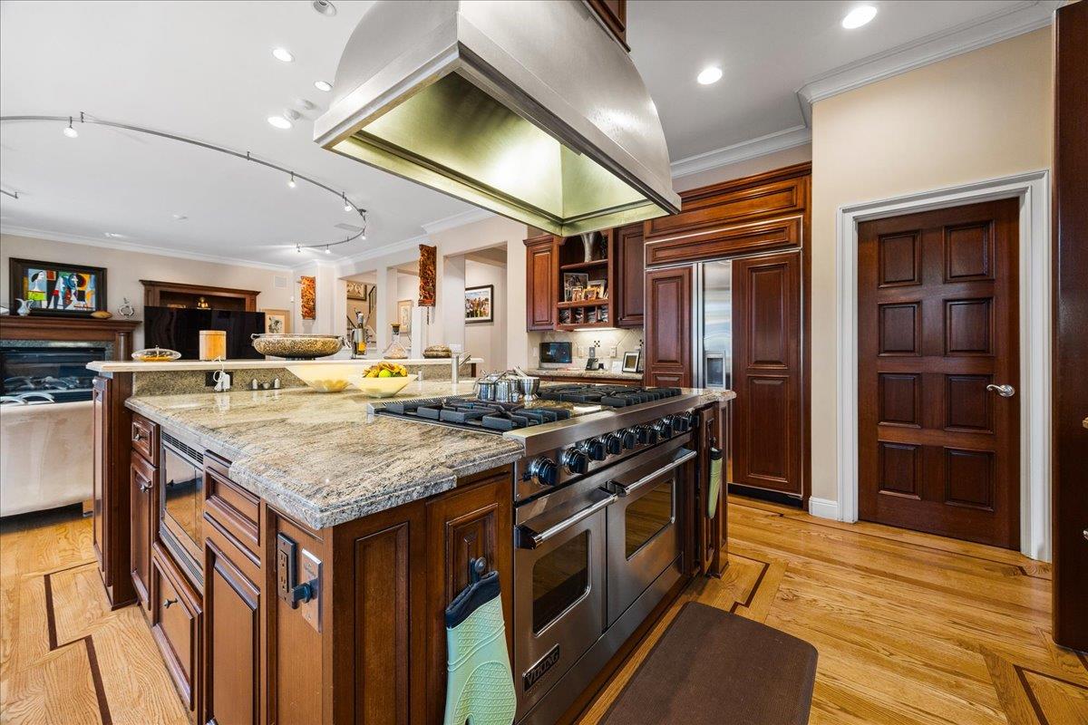 20040 Spaich Court Saratoga, CA 95070 - Photo 32 of 87 a kitchen with stainless steel appliances granite countertop a stove and a refrigerator