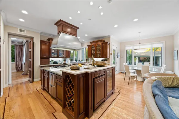 a dining room with furniture a chandelier and a rug