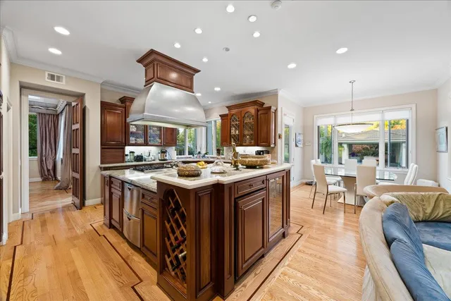 a dining room with furniture a chandelier and a rug