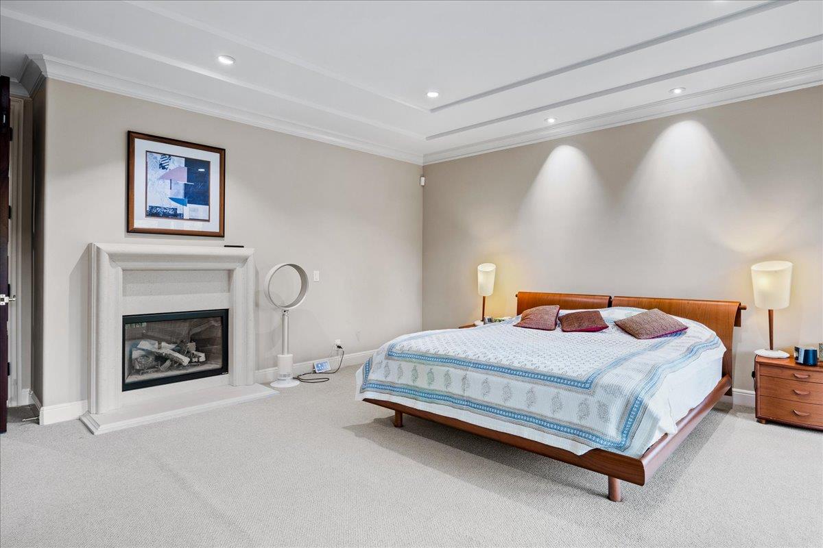 20040 Spaich Court Saratoga, CA 95070 - Photo 35 of 87 a bedroom with a bed and a fireplace